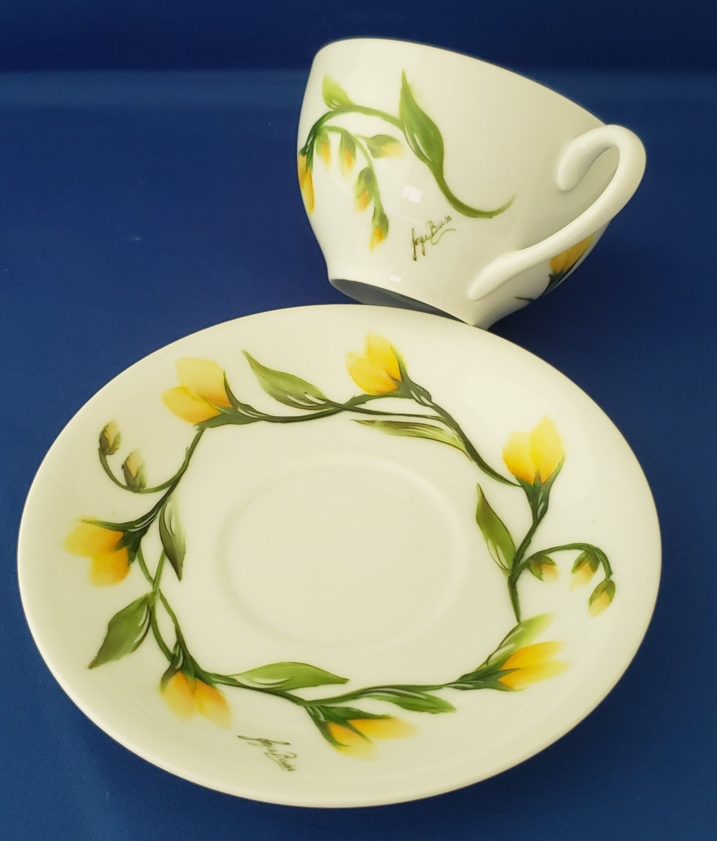 Cup and Saucer with spring yellow flowers designs